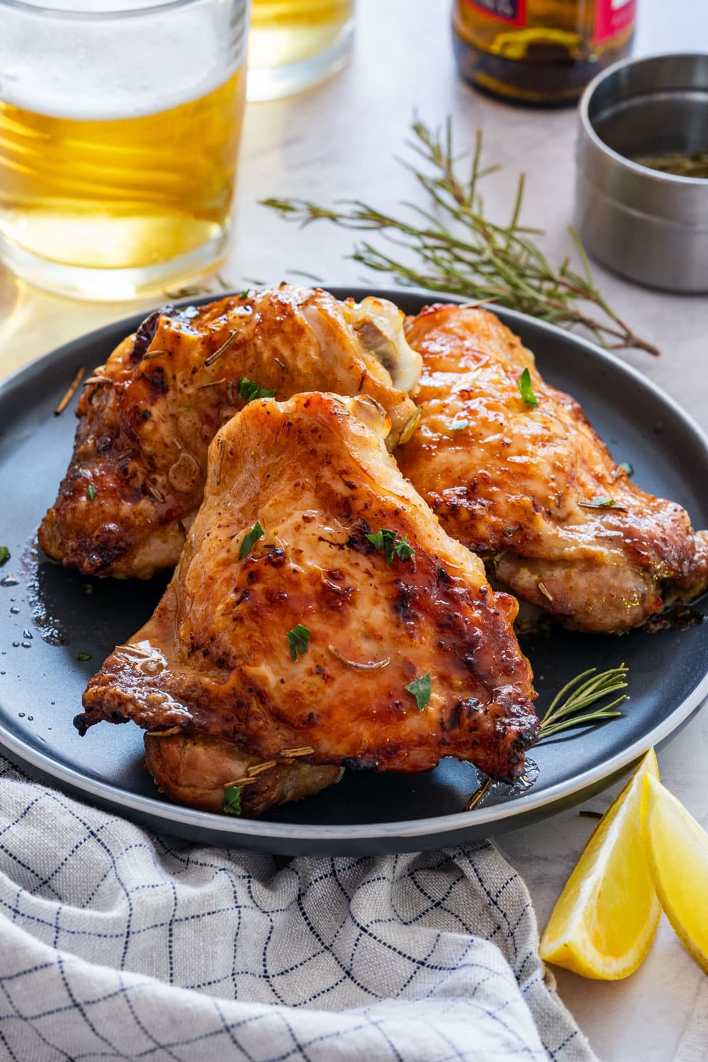 Grilled beer marinated chicken thighs on the plate.