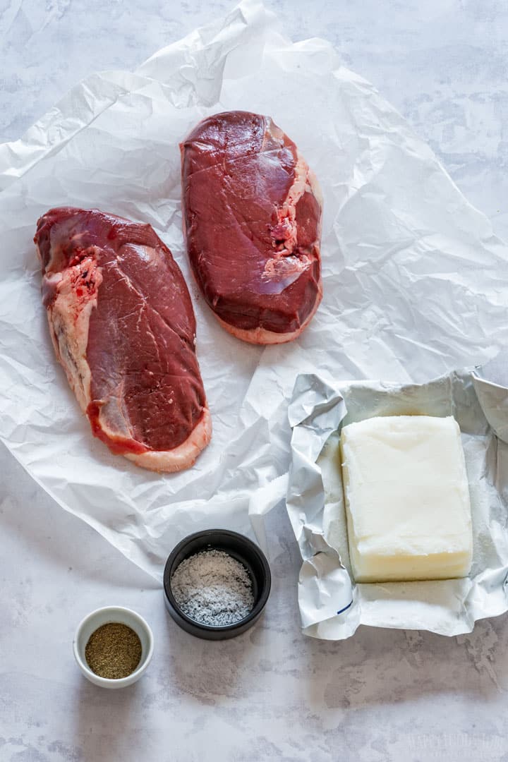 Duck confit ingredients - two duck breast, pork lard, salt and pepper.