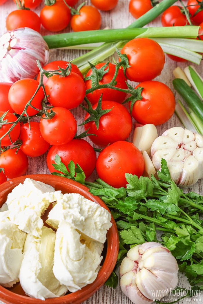 Fresh ingredients for Oven Roasted Cherry Tomatoes with Feta and Mozzarella